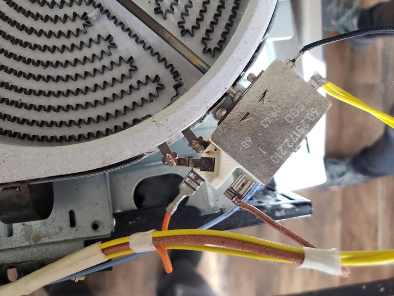 Glass-top stove radiant burner element and wiring during a stove repair in Douglas, GA